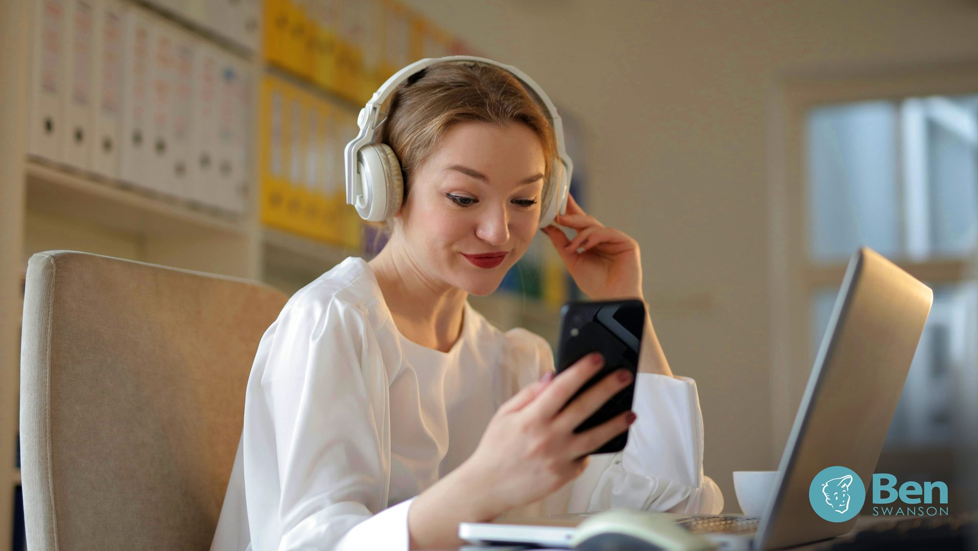 woman analyzing the crowded Spotify album art on her phone